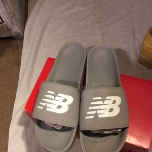 New in box men’s size 17D New Balance slides